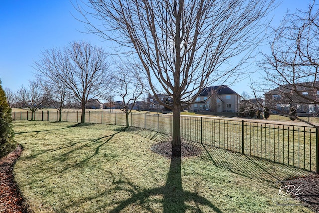 view of yard featuring a residential view and fence