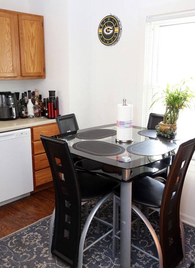 dining space featuring dark wood-type flooring