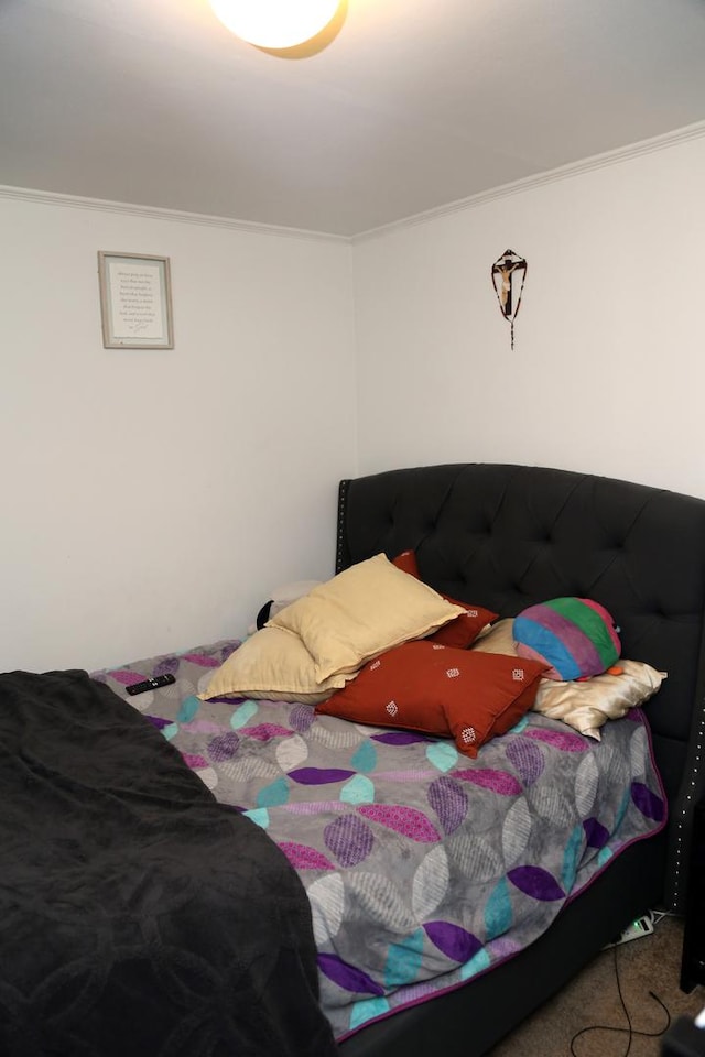 carpeted bedroom featuring ornamental molding