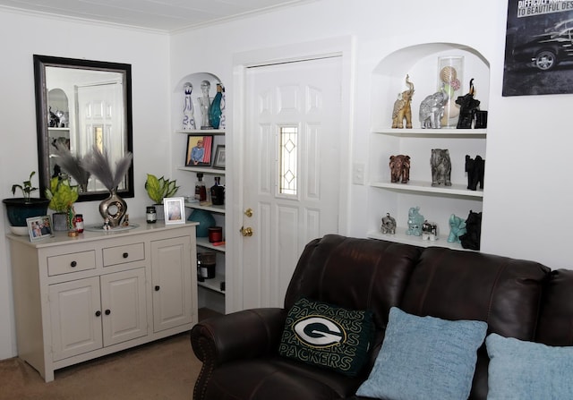 living area featuring ornamental molding and light colored carpet