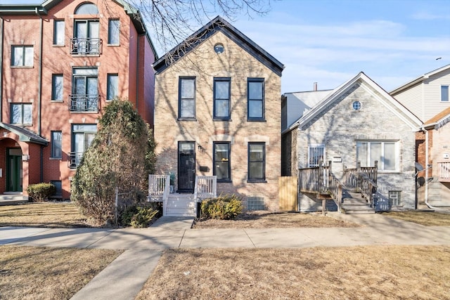 view of front of house featuring brick siding