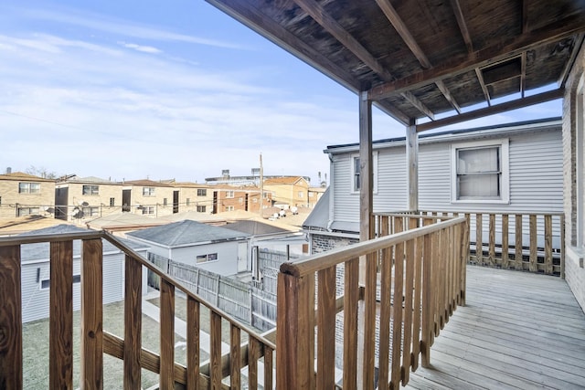 wooden deck featuring a residential view