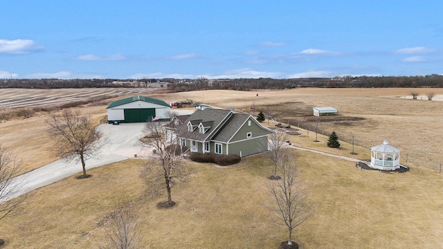 birds eye view of property with a rural view