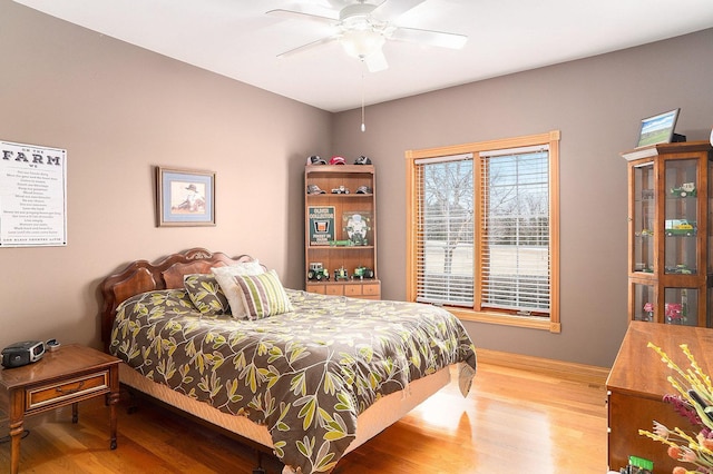 bedroom featuring ceiling fan and wood finished floors