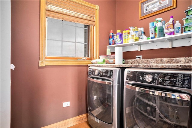 laundry area featuring laundry area, independent washer and dryer, and baseboards