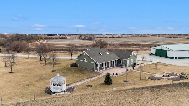 birds eye view of property featuring a rural view