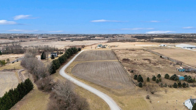 birds eye view of property with a rural view