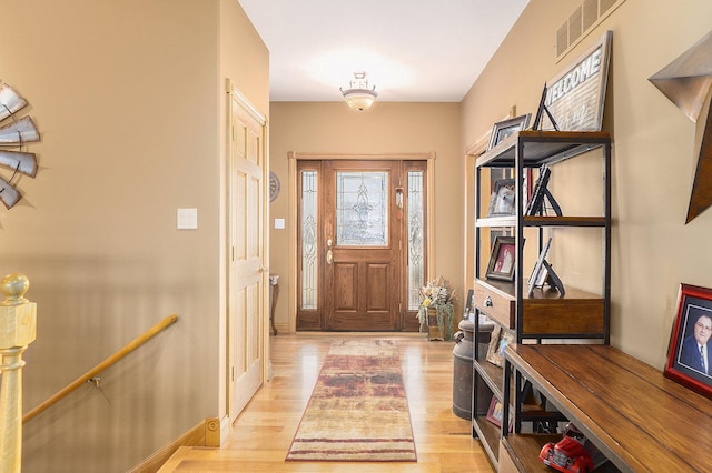 entrance foyer featuring light wood finished floors and visible vents