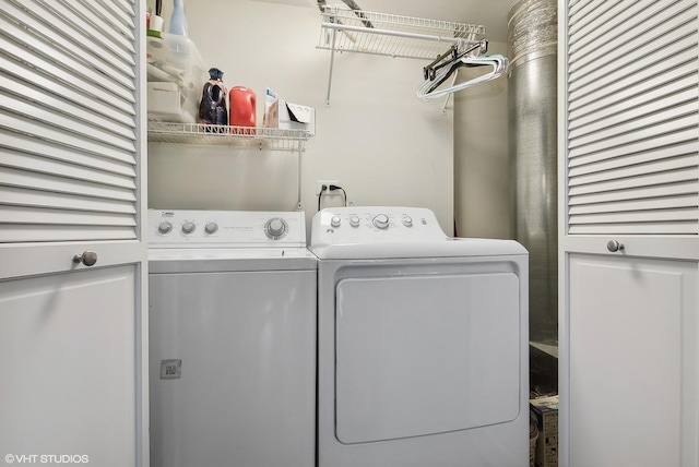 clothes washing area with laundry area and washing machine and dryer