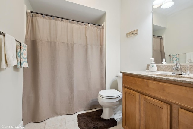 full bath with vanity, toilet, and tile patterned floors