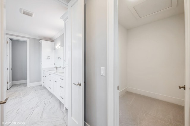 bathroom featuring vanity, visible vents, and baseboards