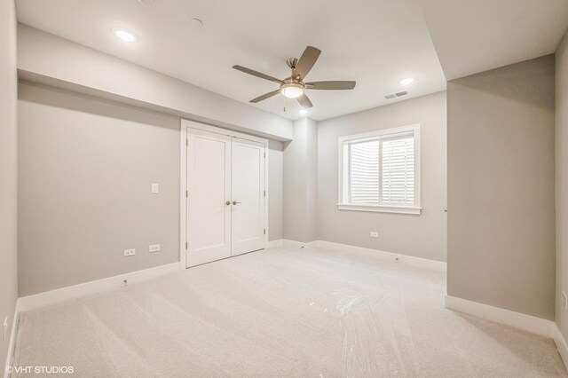 unfurnished bedroom with carpet floors, visible vents, and baseboards