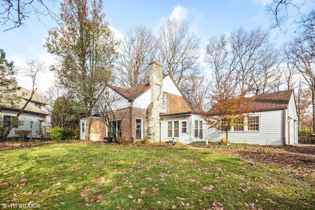 view of front of house with a front lawn and a chimney