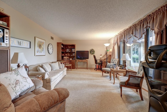 living room featuring light colored carpet, visible vents, and a textured ceiling