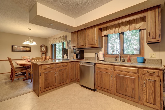 kitchen with pendant lighting, brown cabinets, a sink, dishwasher, and a peninsula