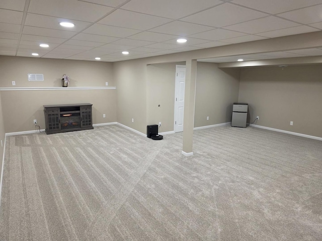 finished below grade area with recessed lighting, carpet flooring, visible vents, and baseboards