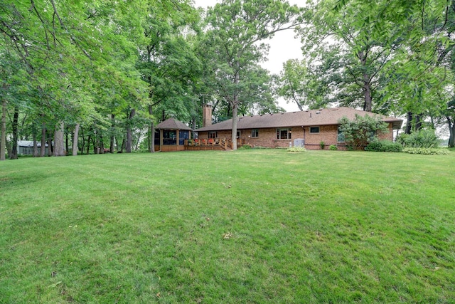 view of yard with a wooden deck