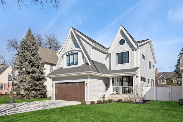 view of front facade featuring a porch, an attached garage, a gate, board and batten siding, and a front yard