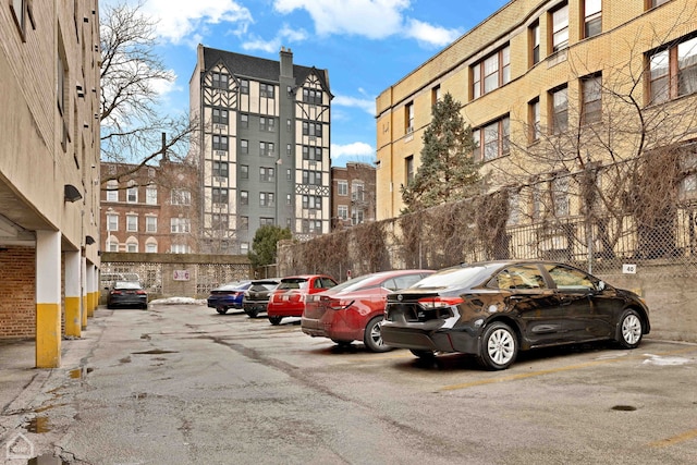 view of property featuring uncovered parking