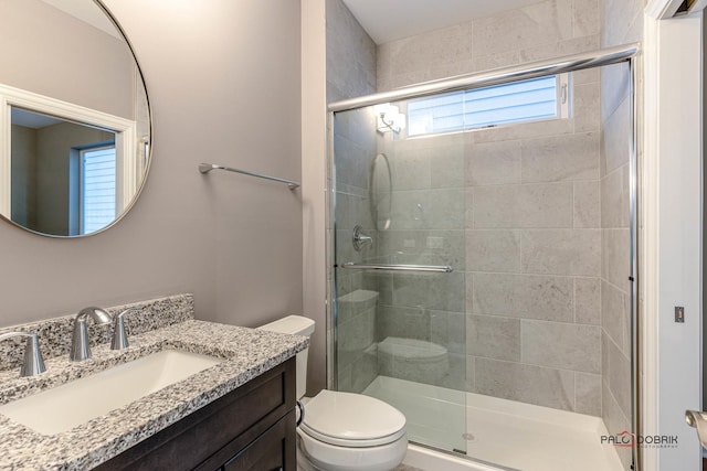 full bath featuring toilet and a shower stall