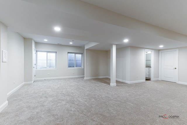 below grade area with carpet floors, baseboards, and recessed lighting