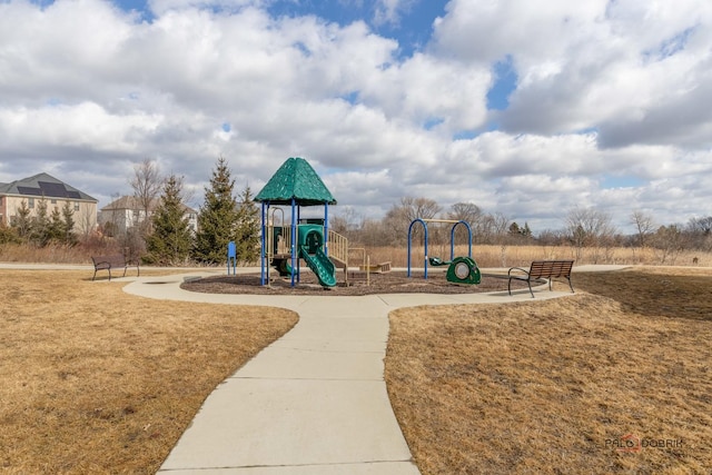 community playground featuring a lawn