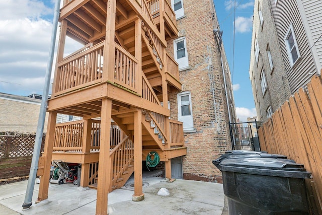 exterior space featuring stairs and fence