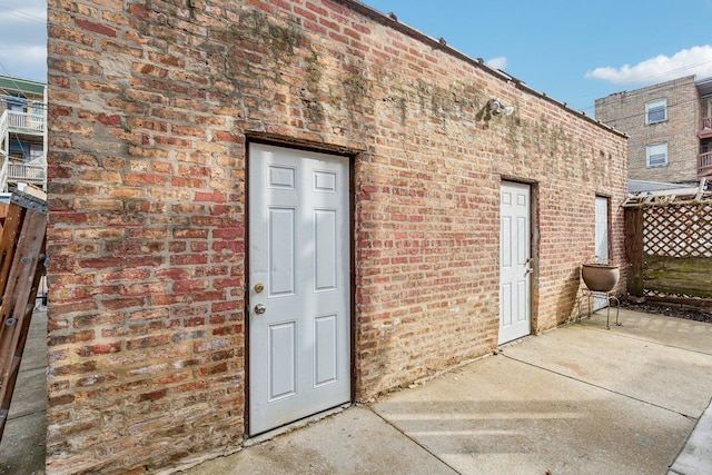 entrance to property with brick siding