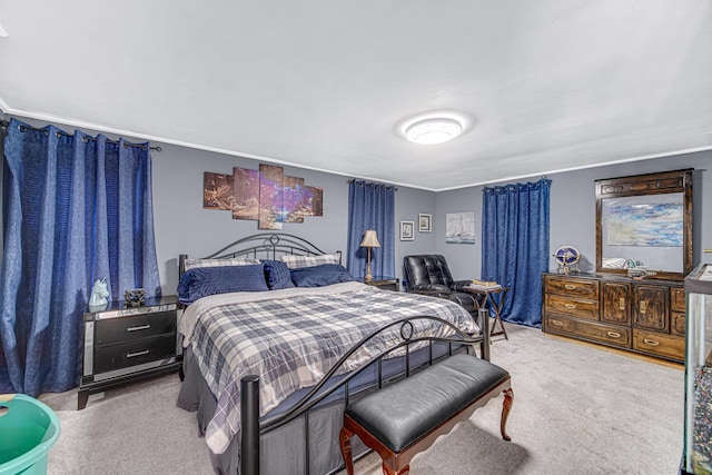 bedroom featuring light colored carpet