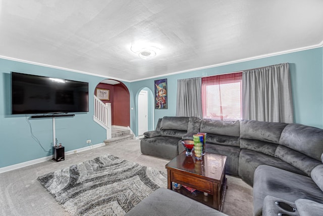 carpeted living room featuring arched walkways, stairs, and baseboards