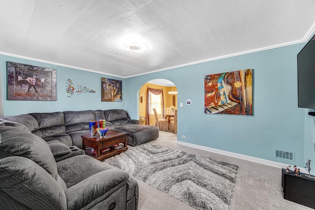 carpeted living room with arched walkways, crown molding, visible vents, a textured ceiling, and baseboards