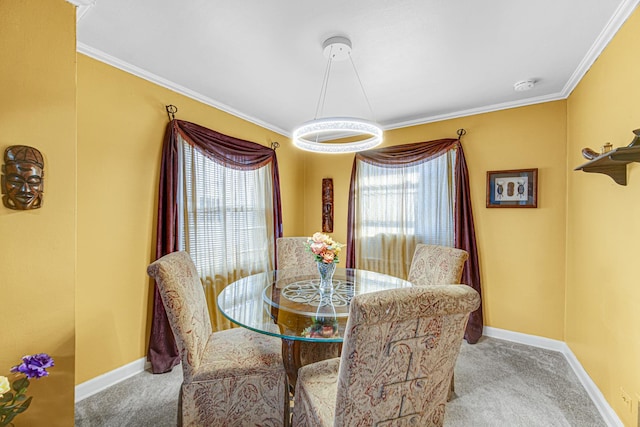 dining space featuring crown molding, light colored carpet, plenty of natural light, and baseboards