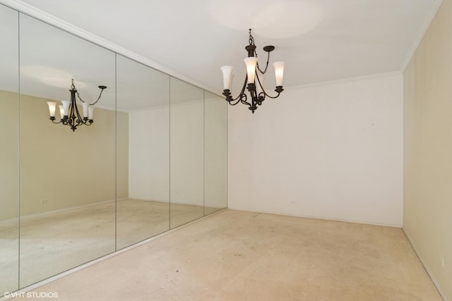 unfurnished dining area with ornamental molding, a notable chandelier, and carpet flooring