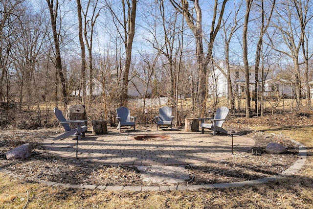 view of yard featuring a fire pit and a patio