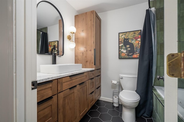 full bath featuring toilet, tile patterned flooring, baseboards, and vanity