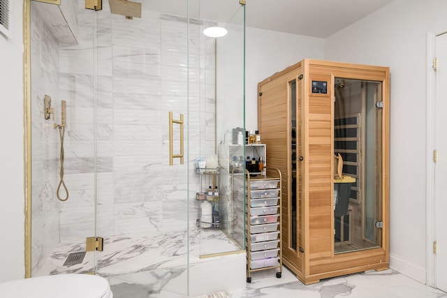 full bath featuring a sauna, a marble finish shower, baseboards, and marble finish floor