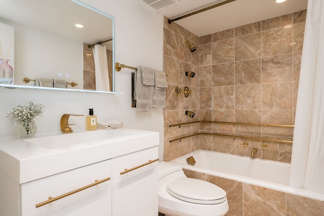 bathroom with vanity, visible vents, recessed lighting, toilet, and tiled shower / bath