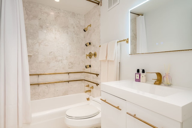 full bathroom with visible vents, toilet, vanity, and shower / bath combo