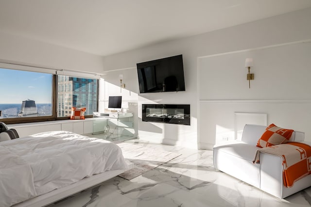 bedroom featuring marble finish floor