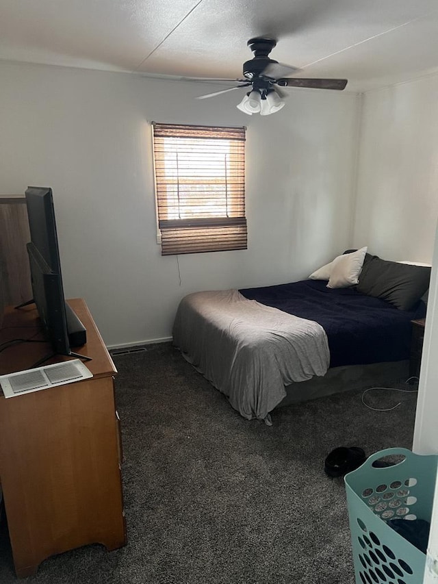 bedroom with ceiling fan and carpet floors