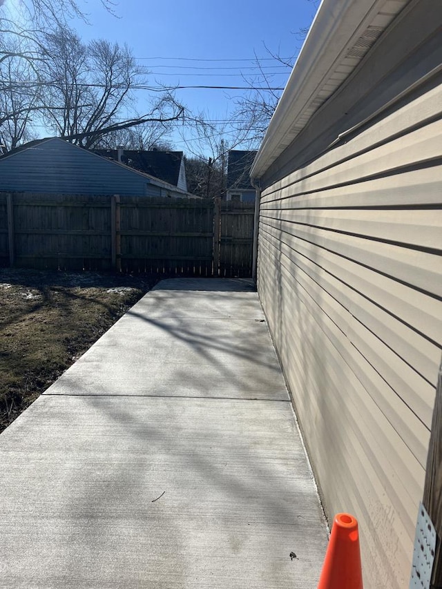 view of patio featuring fence