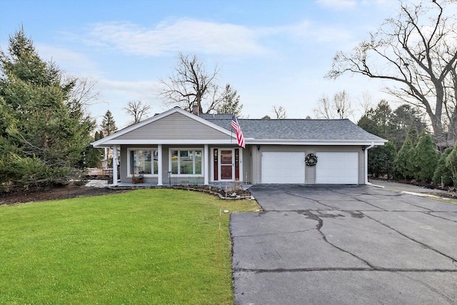 view of front of property featuring a garage, driveway, a shingled roof, and a front lawn