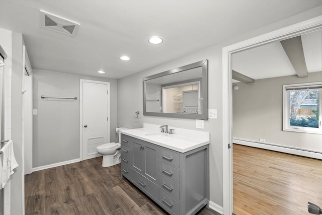 full bath featuring toilet, a baseboard radiator, visible vents, and wood finished floors