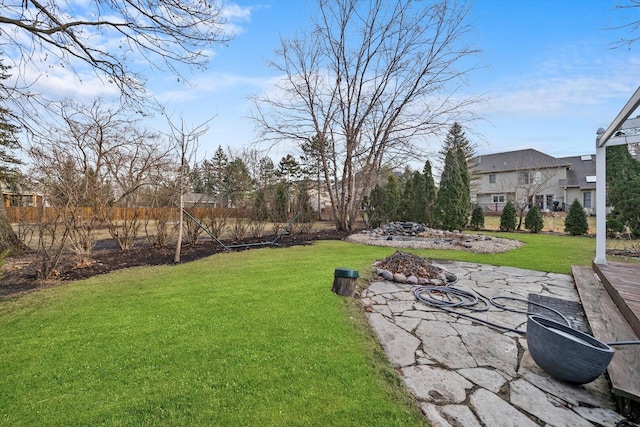 view of yard with an outdoor fire pit and a patio area