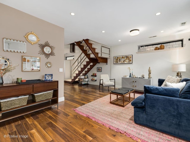 living area featuring visible vents, recessed lighting, stairs, and wood finished floors