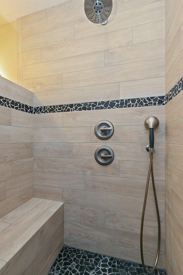 bathroom with a tile shower