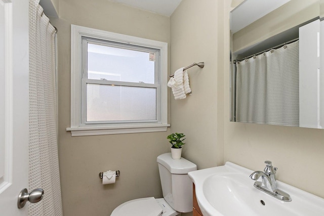 full bathroom featuring toilet and a sink