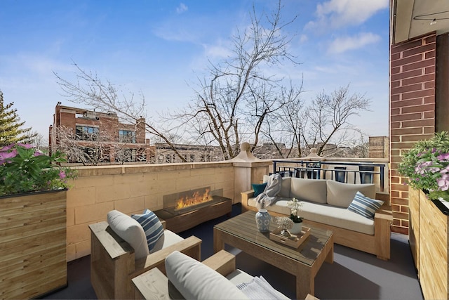 view of patio / terrace featuring a balcony and an outdoor living space