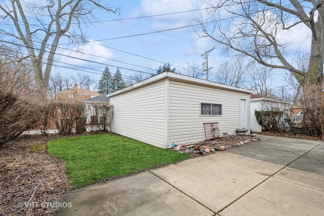 exterior space with a lawn and an outbuilding