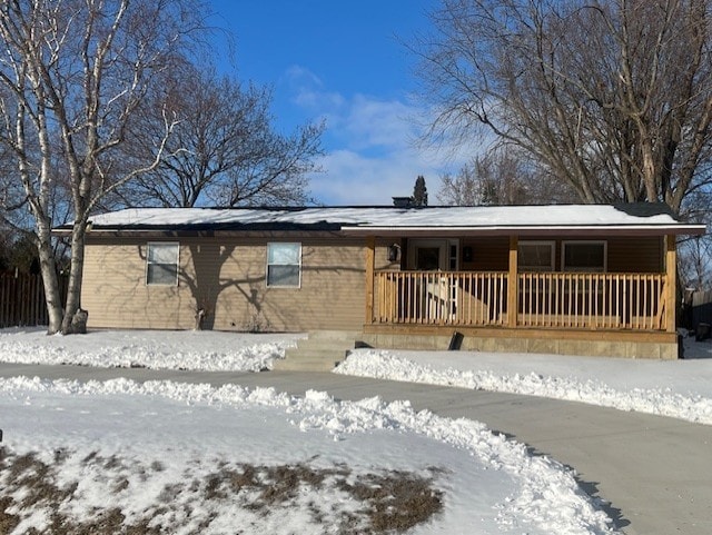 ranch-style house with covered porch